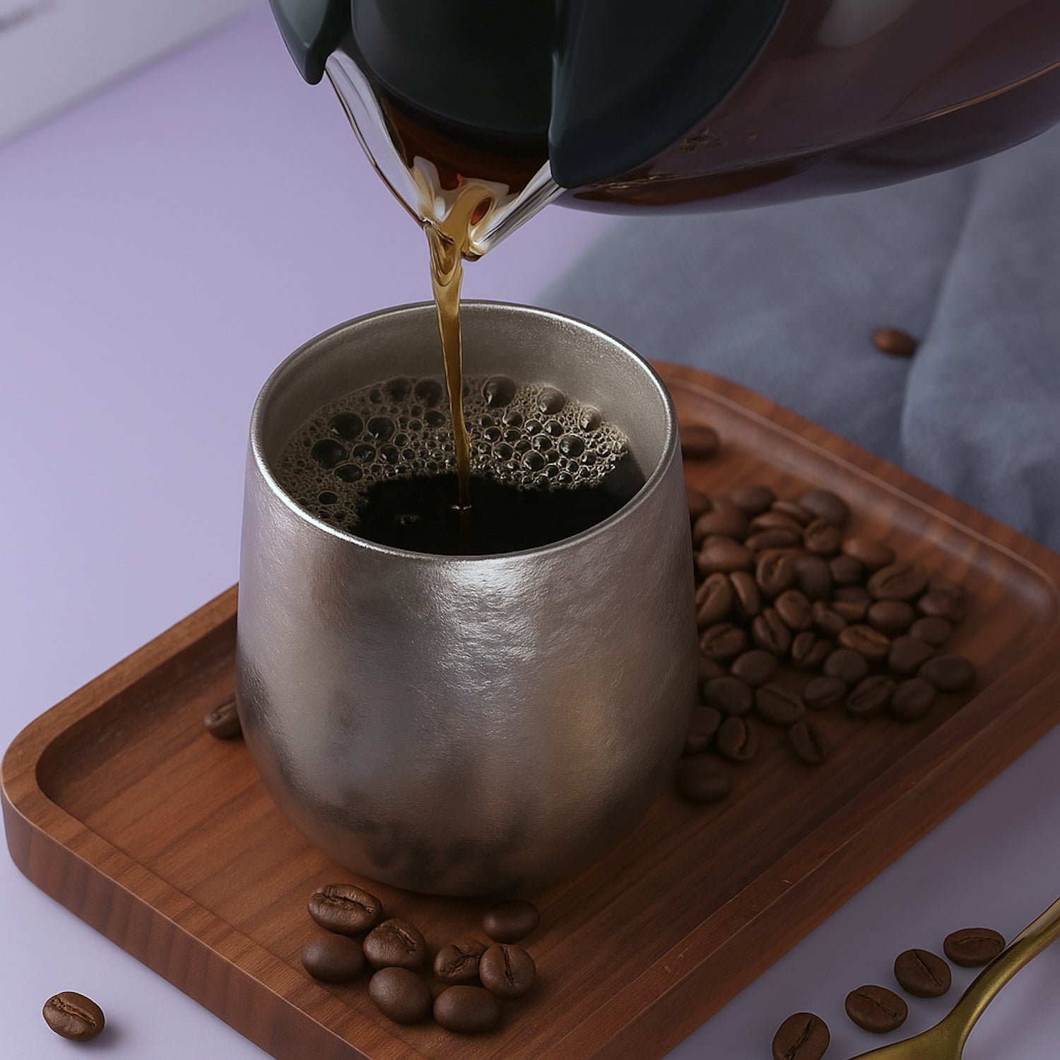 Frost Forge pure titanium cup with Ice Blossom finish, pouring coffee