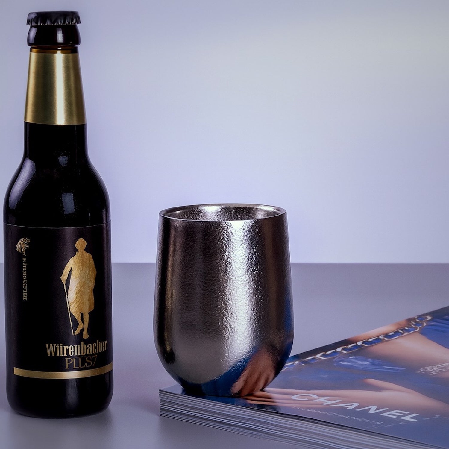 Titanium cup lifestyle shot with beer bottle