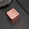 Upgrade your desk with this stylish brushed copper cube