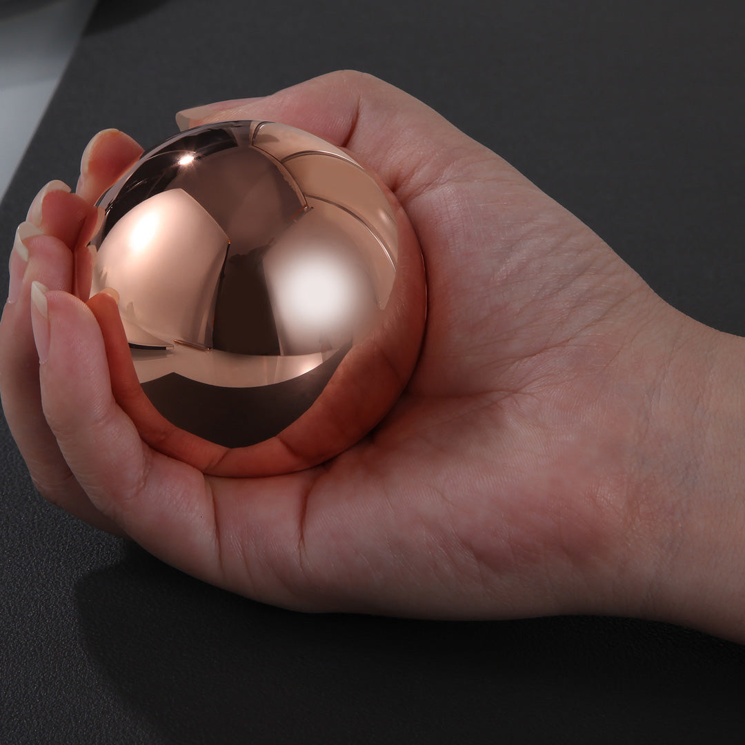 Experience the beauty and weight of this 1 kilogram solid copper sphere with mirror finish - perfect for display